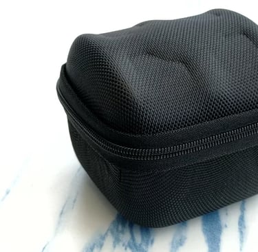 a black case with a zippered pouch on it