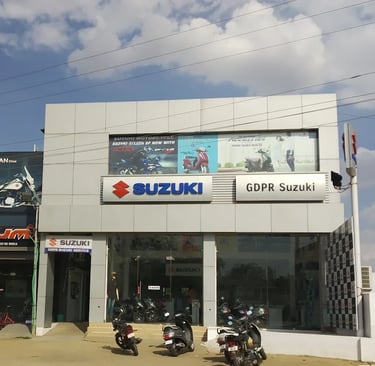 a group of motorcycles parked in front of a building