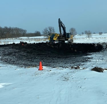 pond being excavated in the snow