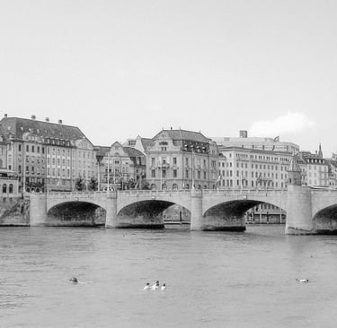 a bridge spanning over a river with several people