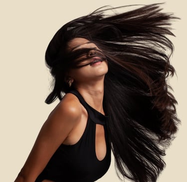 a woman with long hair and a black dress