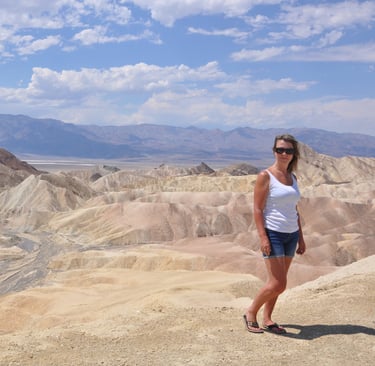 a woman standing at zabreski point, death valley