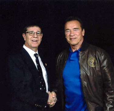 Shihan Mike Monaco shaking hands with Arnold Schwarzenegger at the 2019 Arnold Sports Festival.