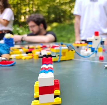 a group of people playing with legos