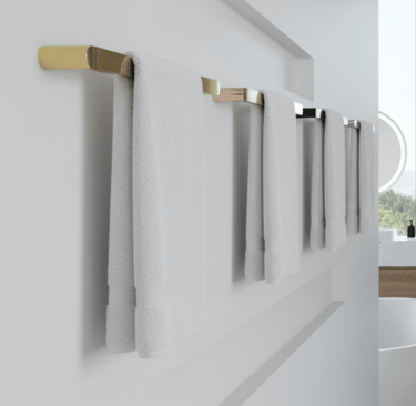 stylish heated towel bars in a range of beautiful finishes shown neatly in a modern luxury bathroom