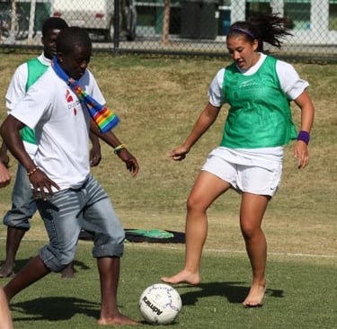Dr. Sam Van Gorder playing barefoot soccer with local students in Egypt during Semester at Sea.