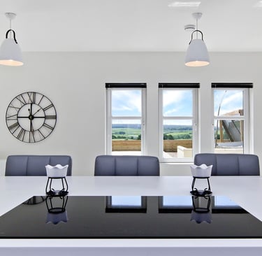 Modern kitchen design with integrated appliances  and a spacious island.