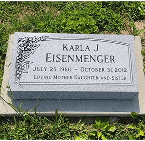 flat gravestone in georgia gray granite with carved butterfly