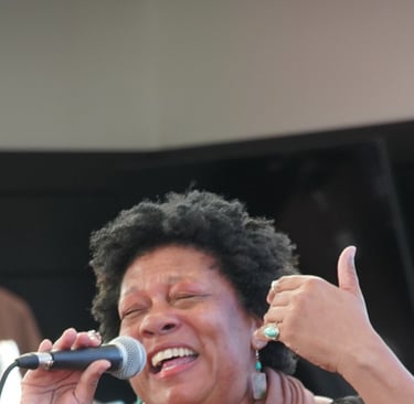 Singer-Songwriter Rhonda Merrick performing a song she wrote with Off The Hook Chamber Orchestra