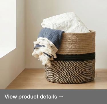 Woven storage basket with folded blankets in a bright minimalist interior