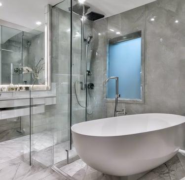 Modern Toronto bathroom renovation featuring sleek tiles, a glass shower, and custom vanity.