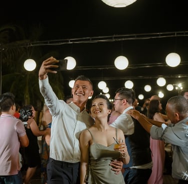 a man and woman dancing at a party