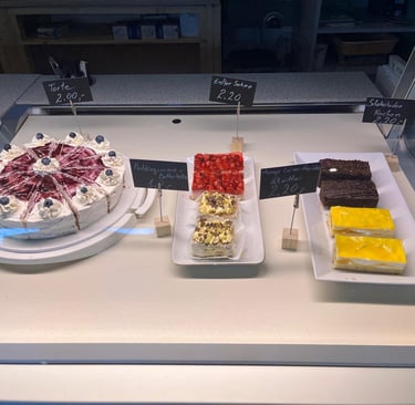 a display case with a variety of desserts
