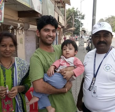 a woman and two men standing in front of a store
