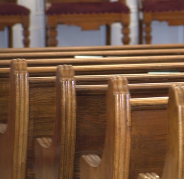 rows of wooden church pews