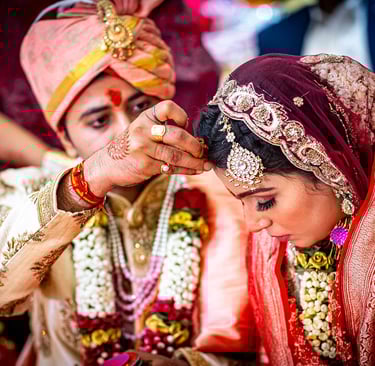 A happy indian couple embracing or celebrating during their wedding reception