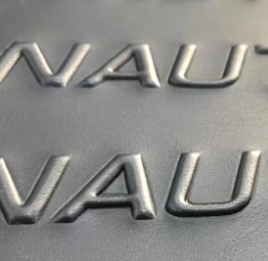 Embossed logo effect on a bag, a durable and premium custom manufacturing option.