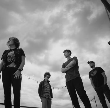 a group of people standing on a skateboard