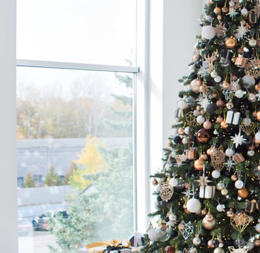 a christmas tree with presents and presents on a white floor
