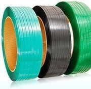 Green PET strapping coils stacked for export shipment