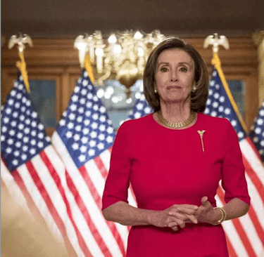 a woman in a red dress standing in front of a group of flags
