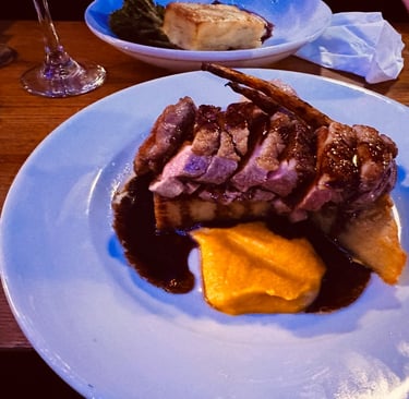 a plate of food and a glass of wine