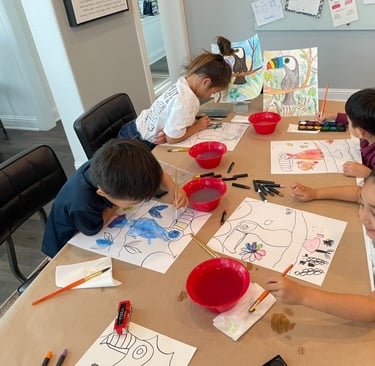 Children focused on drawing colorful artwork