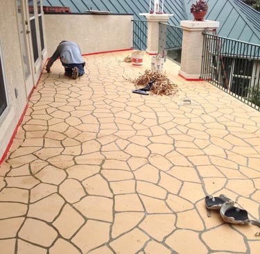 Stenciled concrete surface on baloney.