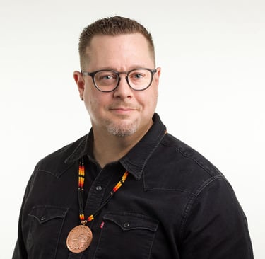 a man with a medallion around his neck