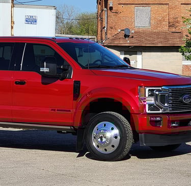 a red ford truck parked in lot after being detailed ceramic coating