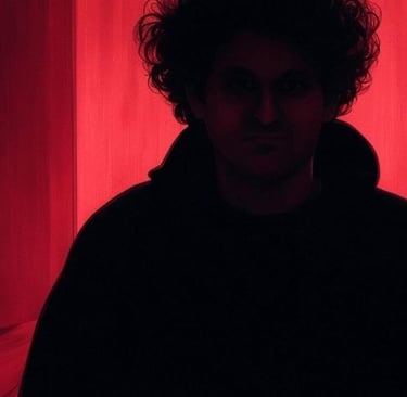 a man in a black hoodie and a red curtain