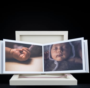 a baby's picture taken in a photo album