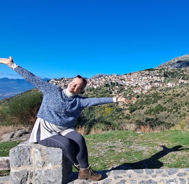  happy woman sitting in mountains
