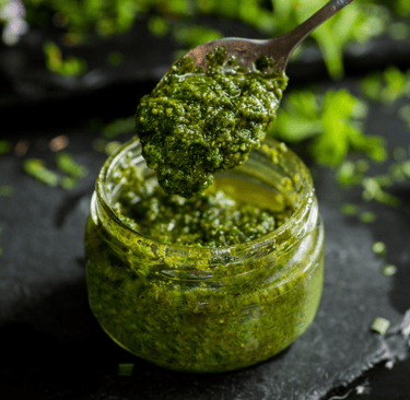 Jar of spinach basil pesto make with Thrive Freeze Dried Spinach