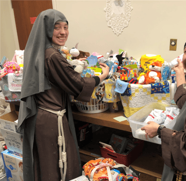 Sisters assembling new baby welcome baskets