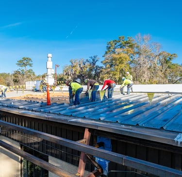 Workers replacing a roof
