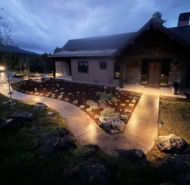 a house with a pathway leading to a driveway