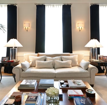 a living room with a couch and a table Nour Nagy Designs London interior Design