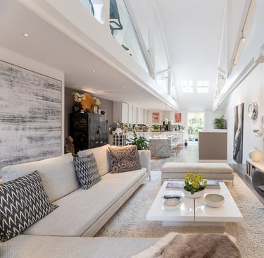 a living room with a couch and a ladder