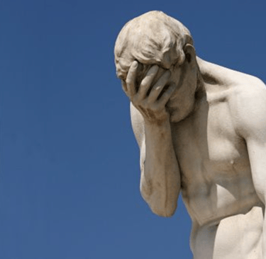 Classical statue of a Roman-era man doing a face palm