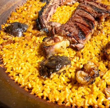 a large pan of food with meat and vegetables