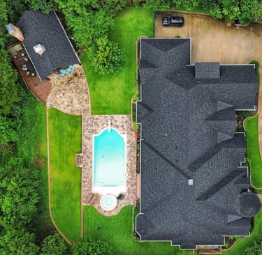 Completed residential roof replacement at a luxury home in Tyler, TX including pool house 