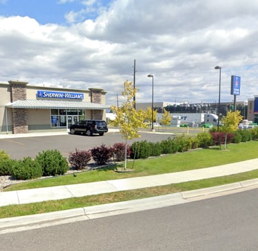 a car dealership with a truck parked in front of it