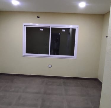 Casa con revestimiento texturado a llana RULATO