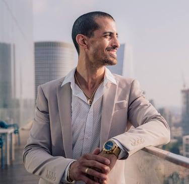 a man in a suit and a watch on a balcony