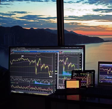 a desk with a laptop and a monitor screen