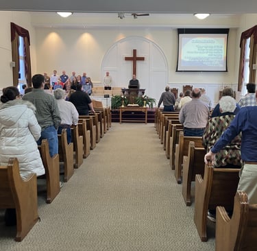 an old fashioned church filled with people singing praise to God