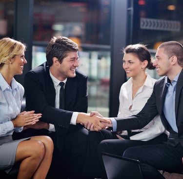 partners shaking hands with smile