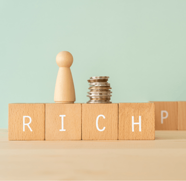 a stack of coins and a stack of coins with the word rich