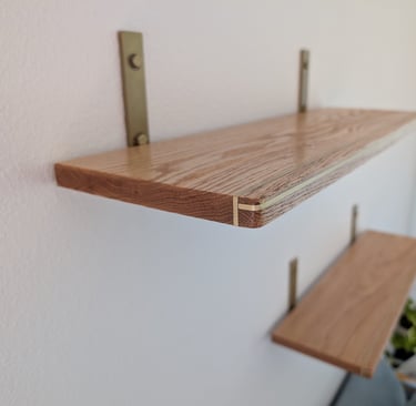 custom oak floating shelves with brass inlay for office